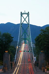 Lions Gate Bridge at Twilight Long exposure of Lions Gate Bridge at twilight with car light trails and mountains.