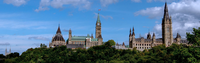 Canada's Parliament in Ottawa Parliament buildings in Ottawa, Peace Tower, flag, blue sky, green trees.